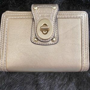 Coach gold passport holder